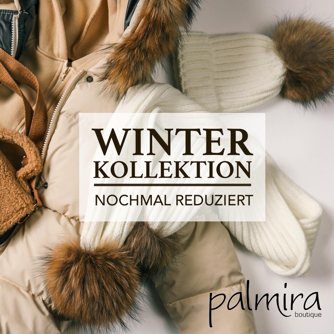 Modische Mützen Schals, Jacken auf einem Präsentiertisch